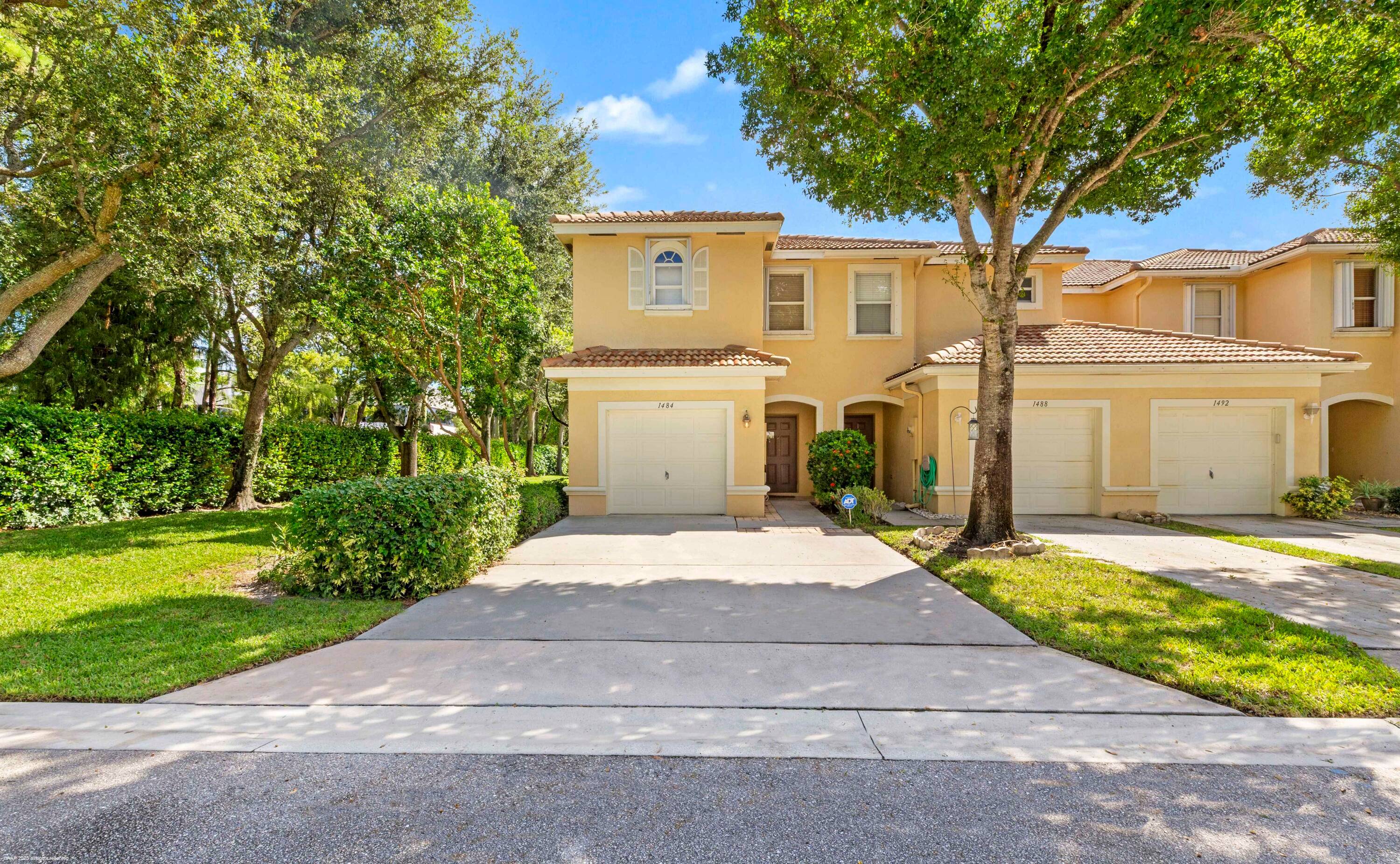 Welcome to this charming three bedroom, two and a half bath townhouse set within one of Wellington's most inviting communities.