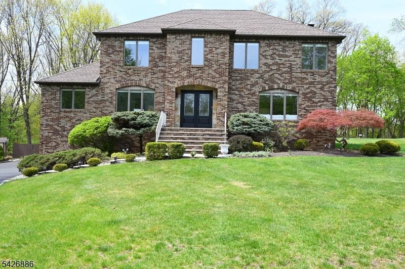 Beautifully renovated brick Colonial set on a private 3 4 acre lot in a quiet double cul de sac.