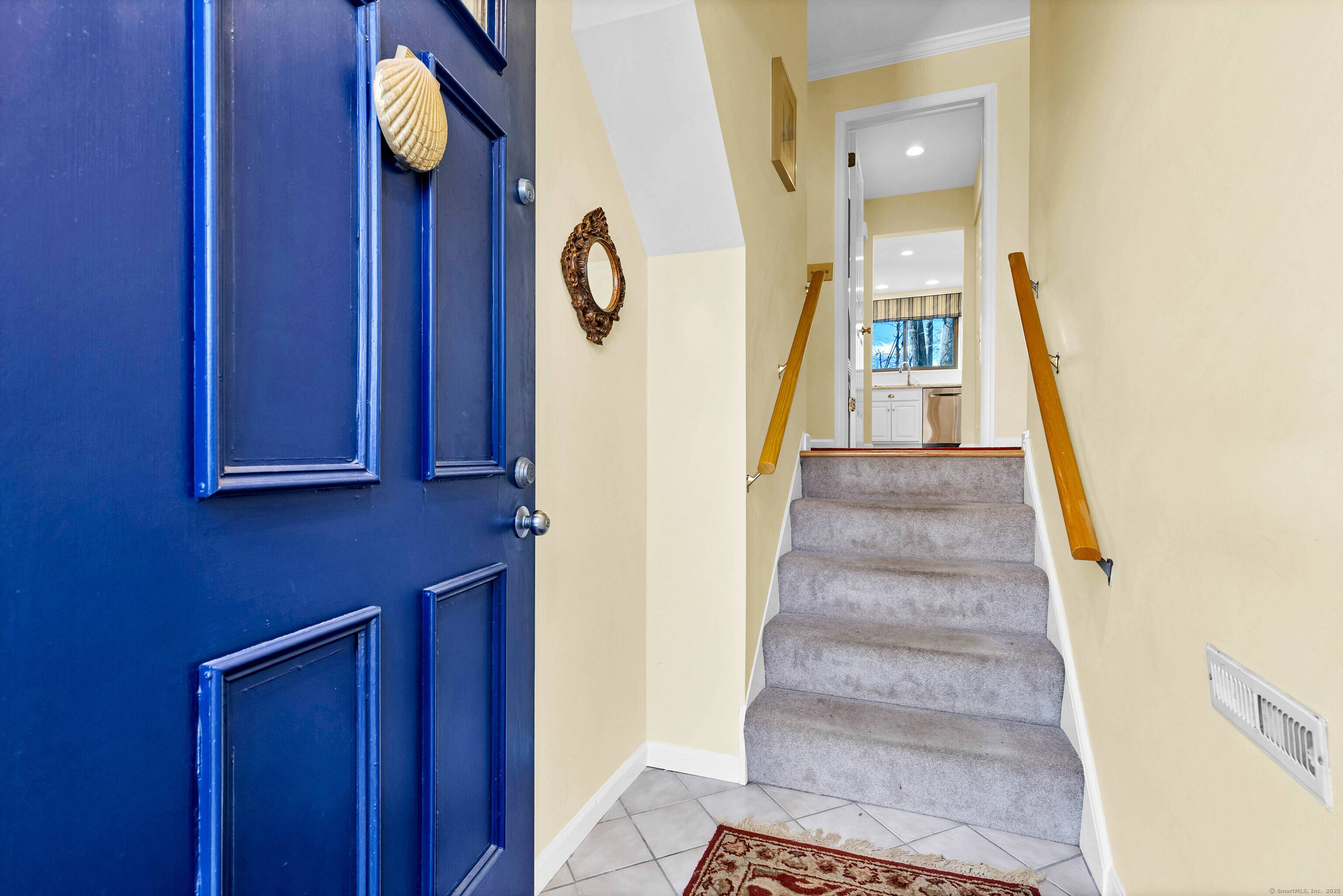 Step into this stunning townhouse condominium featuring a fabulous kitchen with spacious quartz counters and breakfast bar, custom designed cabinetry and stainless steel appliances.