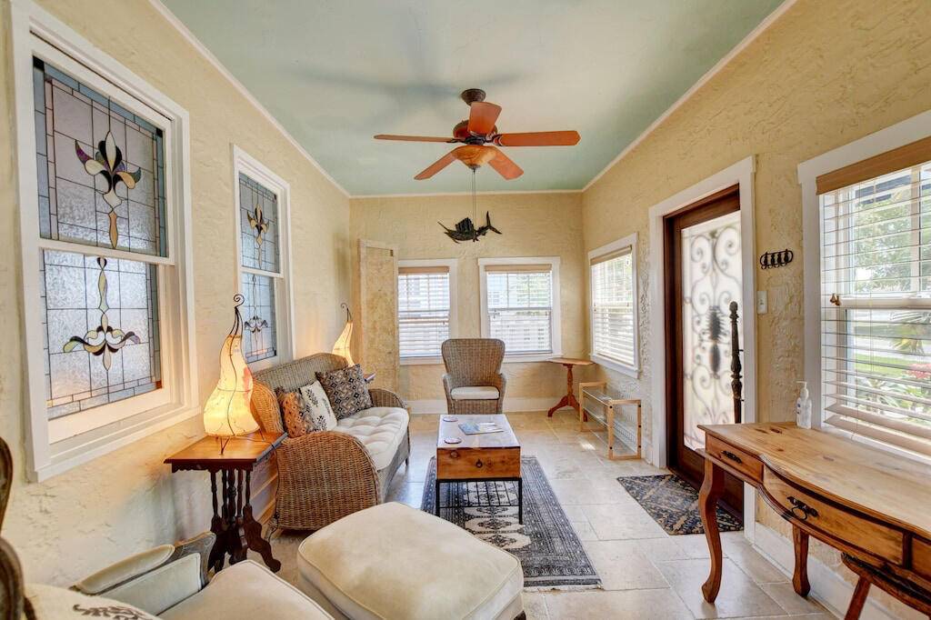 Picturesque historic cottage off Pineapple Grove with hardwood floors, french doors, high ceilings, a fireplace a gourmet kitchen with a gas viking range.