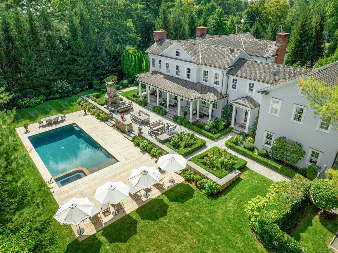 Experience the pinnacle of sophisticated living in this extraordinary estate by renowned builder Kaali Nagy, perfectly situated within walking distance to the village, train, and nature center.