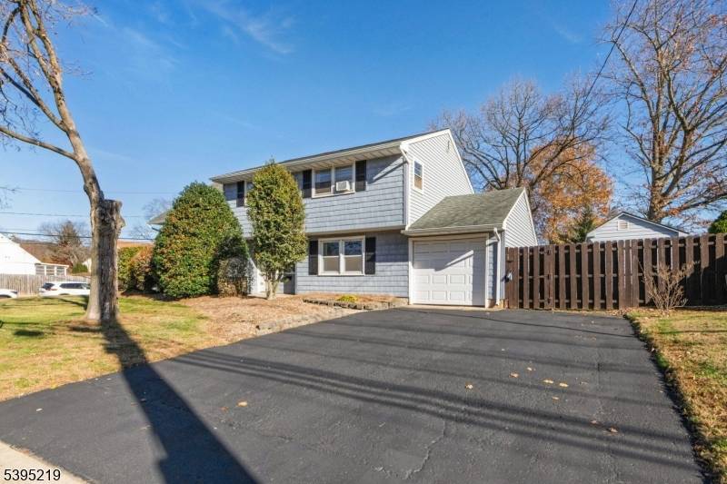 Just reduced ! Elegantly updated stainless steel appliances, while the adjacent dining room opens to a spacious wraparound deck ideal for outdoor entertaining.