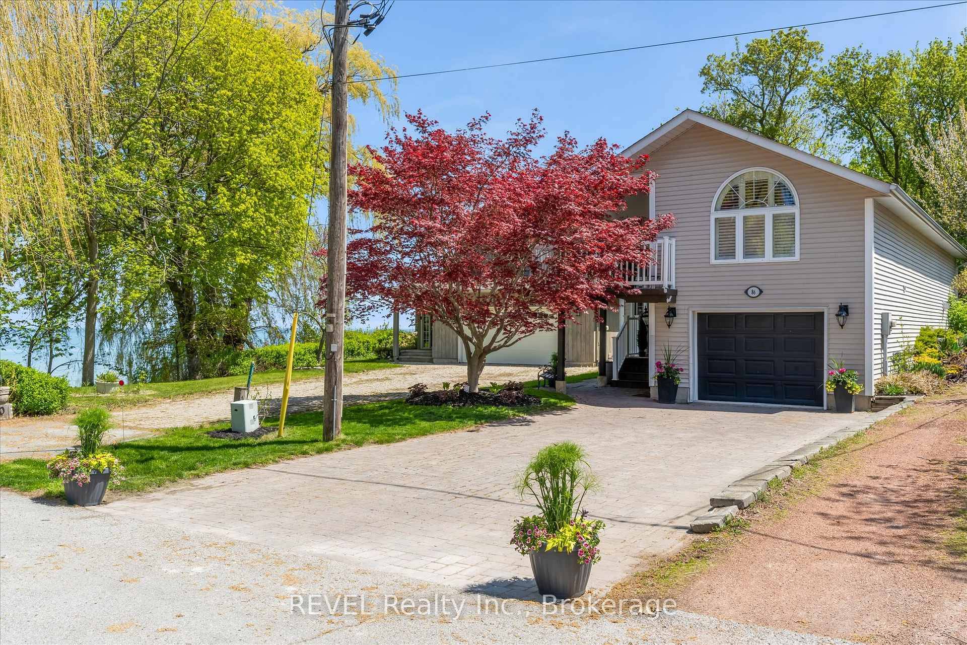 Where waves compose your morning soundtrack and golden sunsets close each day, this two bed, three bath lakefront retreat delivers the lakefront life you've pinned to every vision board.