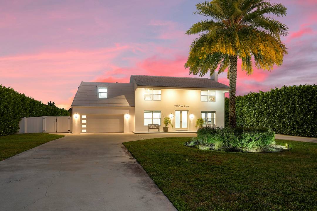 A modern estate in Lake Clarke Shores, this 2 story 5 bed 5 full bath estate blends elegance and function situated on the widest section of the freshwater lake.