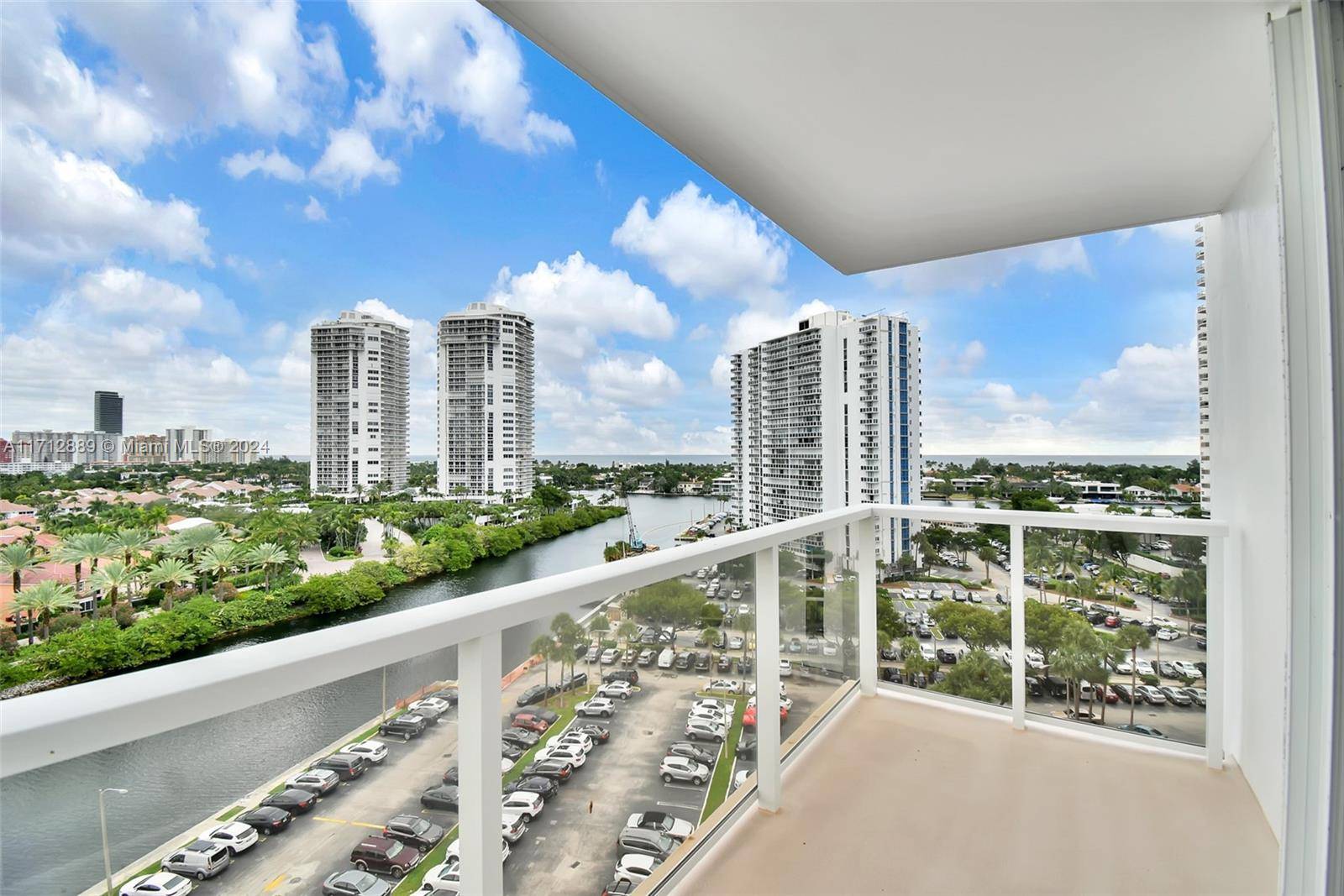 Renovated apartment with 2 bedrooms, 2 bathrooms, storage, and parking, offering premium views of Turnberry Golf Course, Sunny Isles Beach, and the Intracoastal.