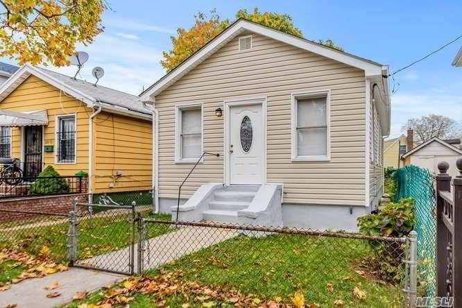 Luxuriously renovated detached 1 family nestled on a beautiful tree lined street in Jamaica.