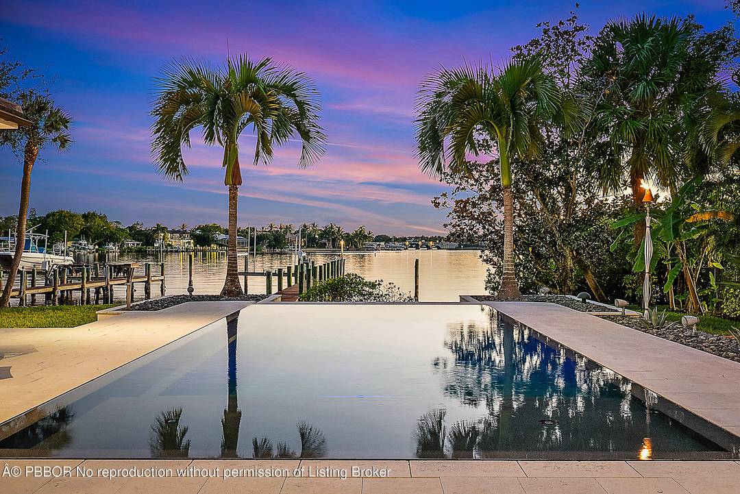 Nestled on nearly one acre of pristine riverfront, this exceptional estate offers breathtaking wide water views facing south.