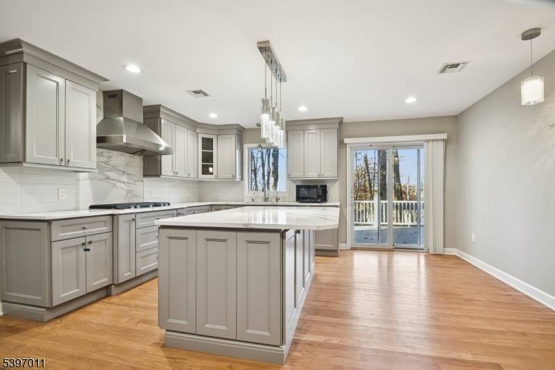 Welcome to this spacious and beautifully updated colonial set on a serene lot in Randolph's coveted Shongum Lake section.