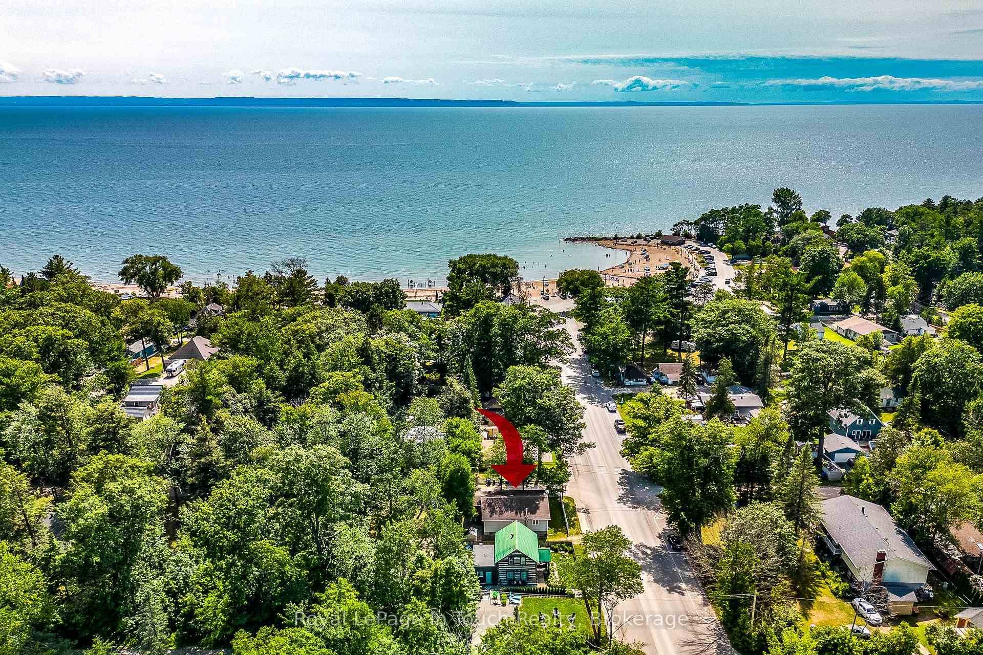 Enjoy the beauty of year round cottage living in Tiny with only a 3 minute walk to one of the most desired beaches on Georgian Bay.