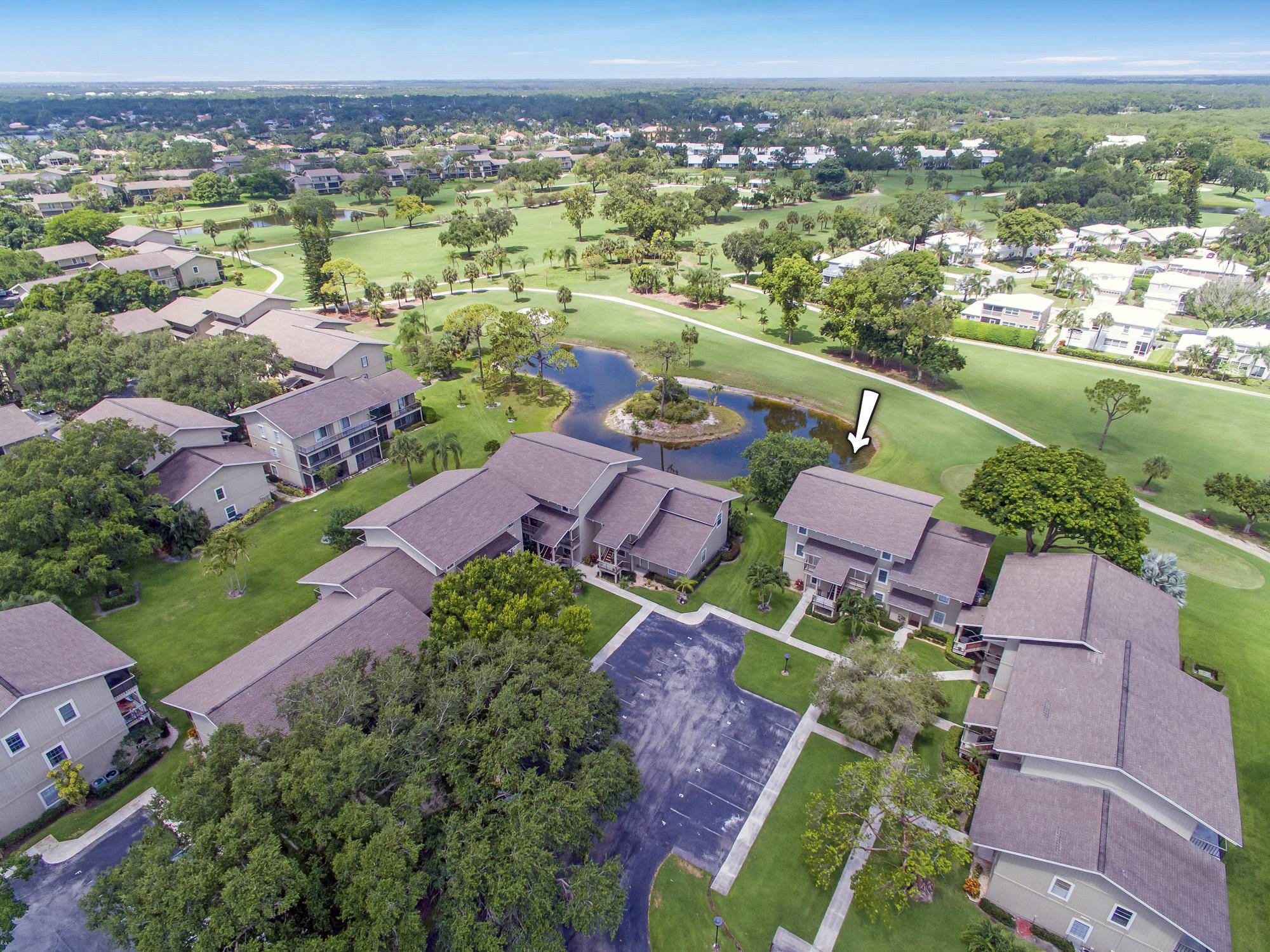 Terrific golf, pond, and sunset views surround this wonderful 2BR 2BA one level condo located on the 18th hole of the Fazio course in the private, waterfront community of Riverbend.