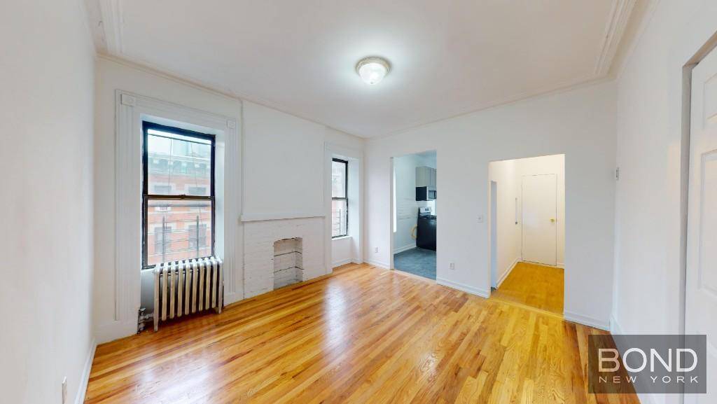 Rent stabilized ! Massive 900 sq ft bright, beautiful and newly renovated 1 bedroom floor through apartment with 2 windowed home offices.
