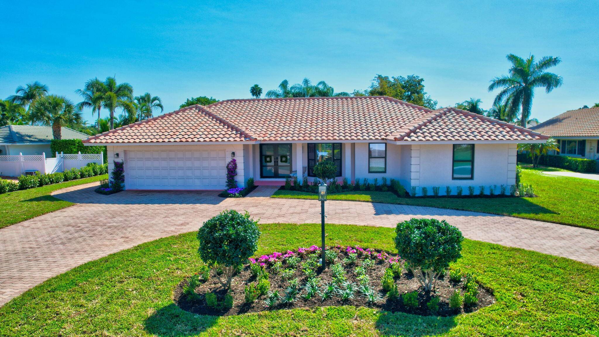 Nestled in the exclusive gated Delray Dunes Country Club, this stunning home perfectly balances natural light and the sparkle of the lake and pool, creating an ideal setting for indoor ...