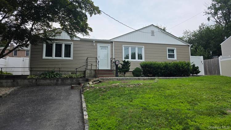 Spacious, bright ranch house with level fenced in backyard.