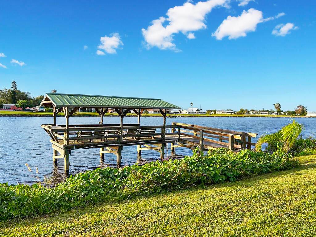 BOATER'S PARADISE ! Welcome to this lovely riverfront home, perfectly set on 1.
