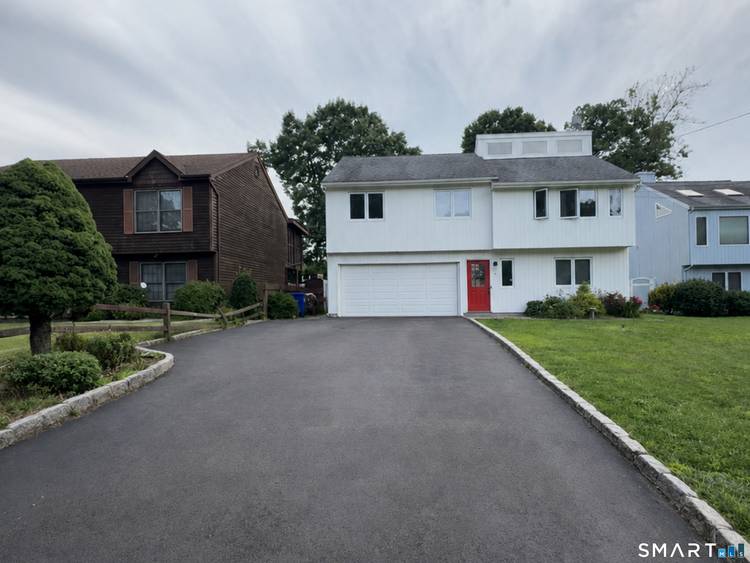 Welcome to this beautifully maintained and exceptionally spacious home located on a quiet cul de sac in one of Norwalk's desirable neighborhoods.