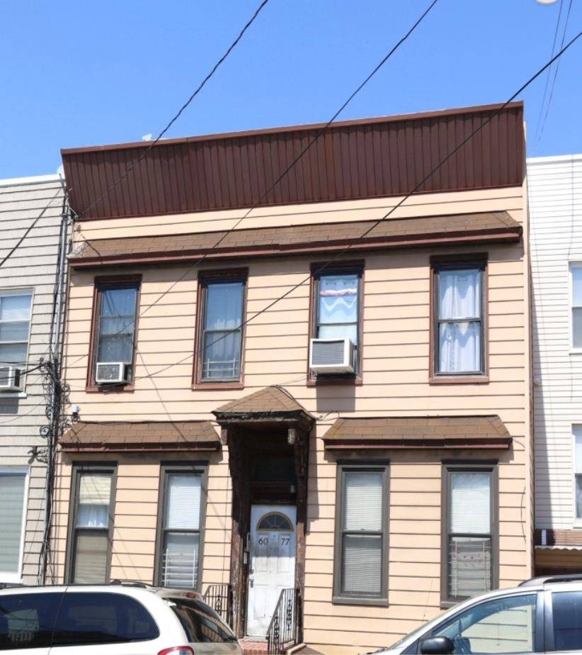 4 Family home ; all 4 apartments consist of 2 bedrooms and 1 full bath each.
