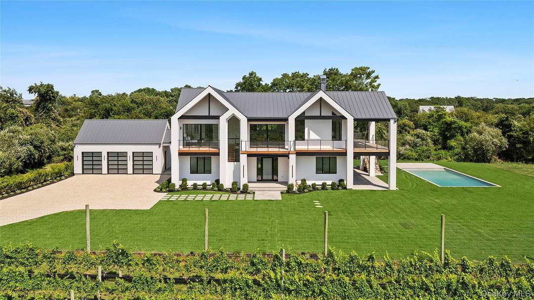 Experience the epitome of luxury living in this modern newly construction estate, a truly unique offering on the East End framed by breathtaking vineyard views.