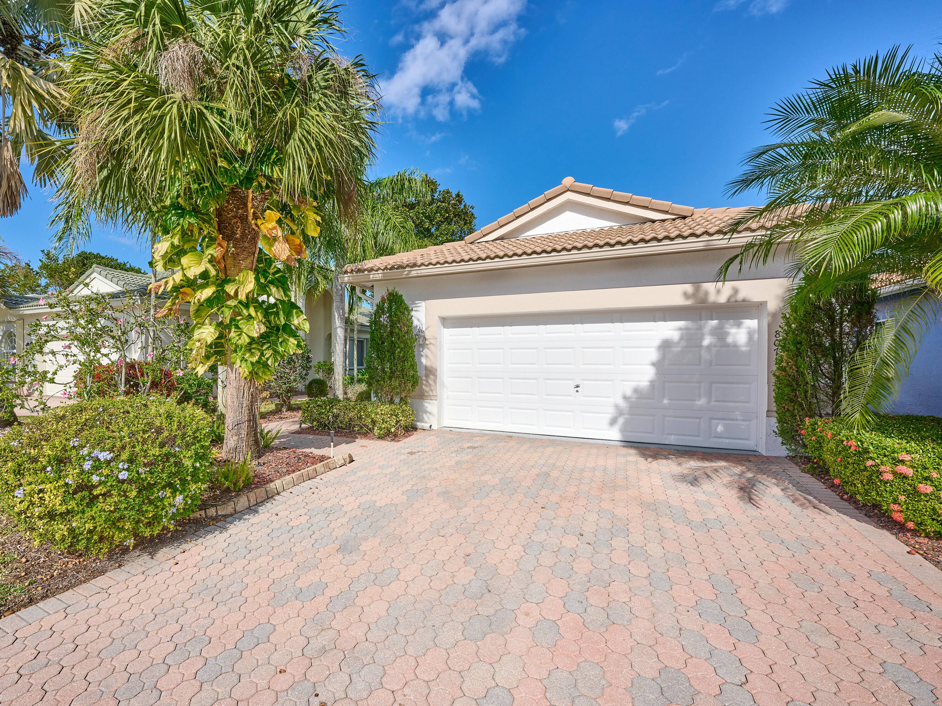 Enjoy all that Venetian Isles has to offer from this lakefront Portofino model in Sorrento.