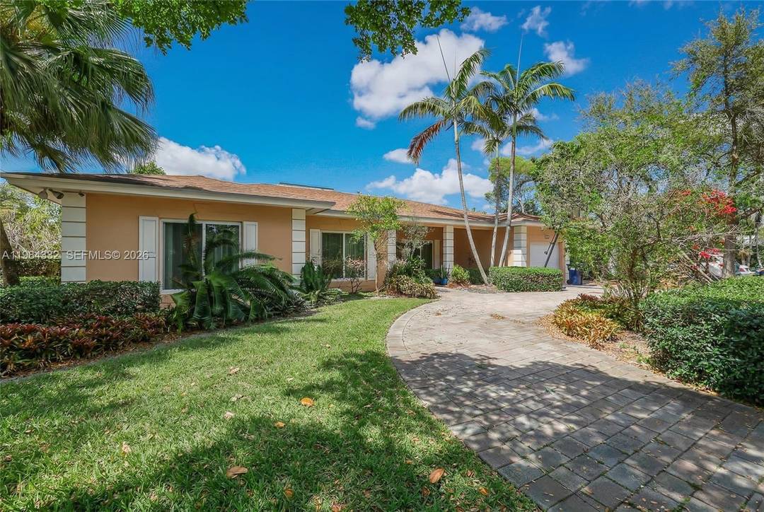 Spectacular Custom Built Corner Pool Home in Adorable Miami Springs.