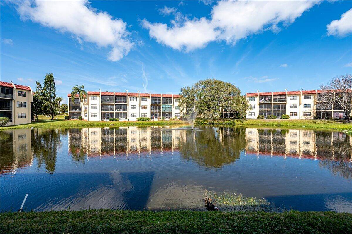 Welcome to this delightful 2 2 FIRST FLOOR corner unit 3 101 in gated Island House Condominiums !