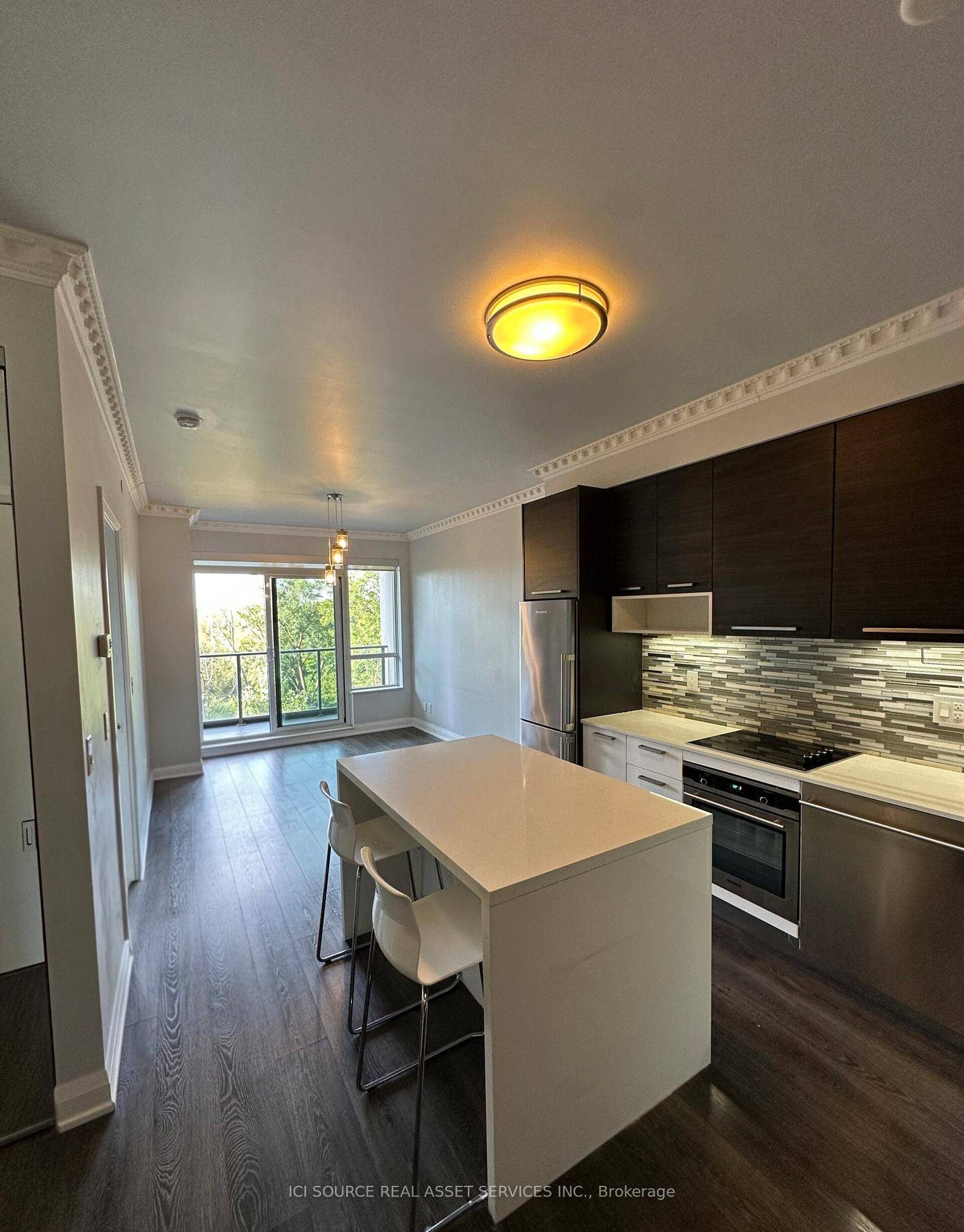 Available Now. Luxury Open Concept unit with Crown Molding Throughout.
