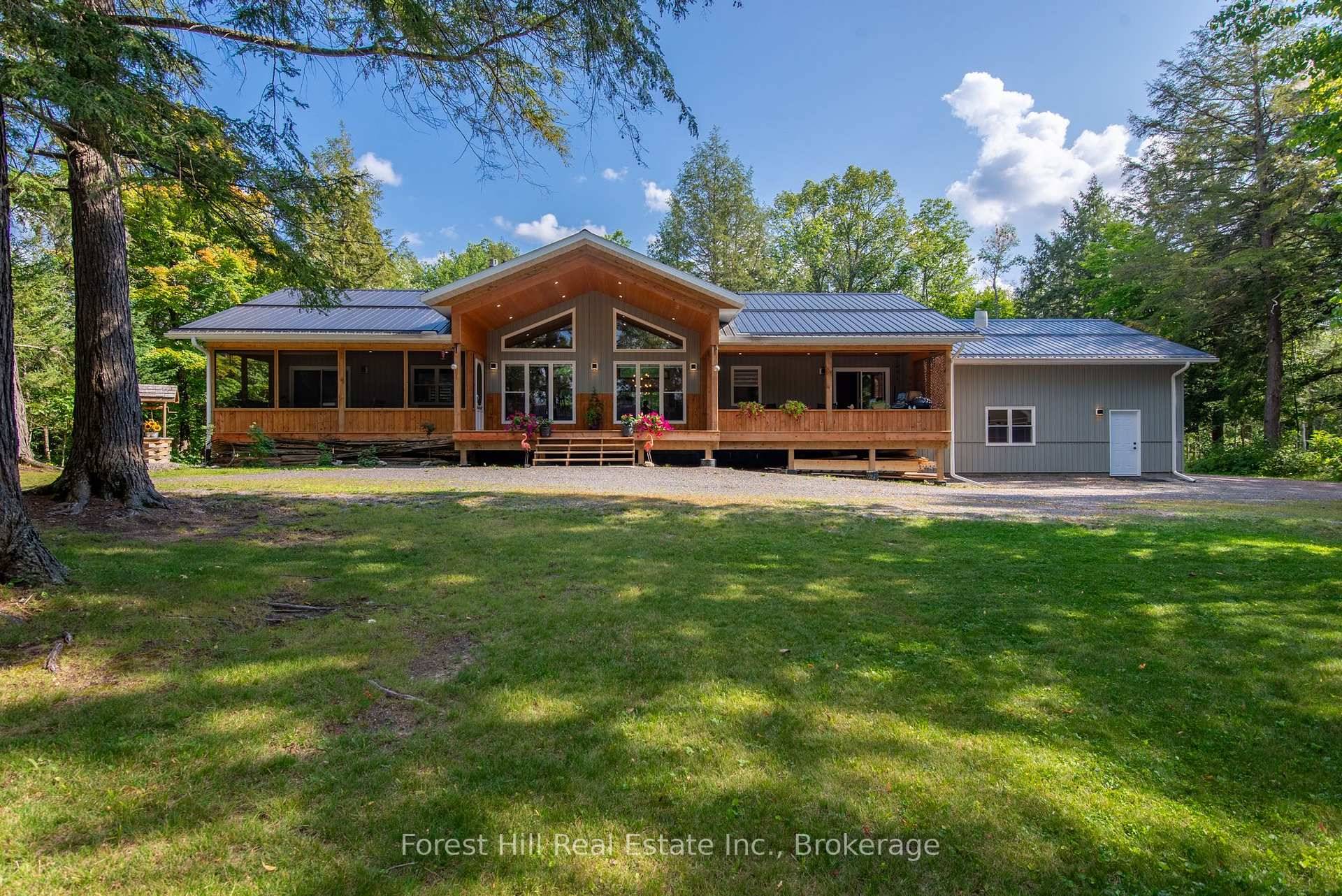 Embrace unparalleled lakeside living with this remarkable year round home, crafted to seamlessly blend luxury and comfort.