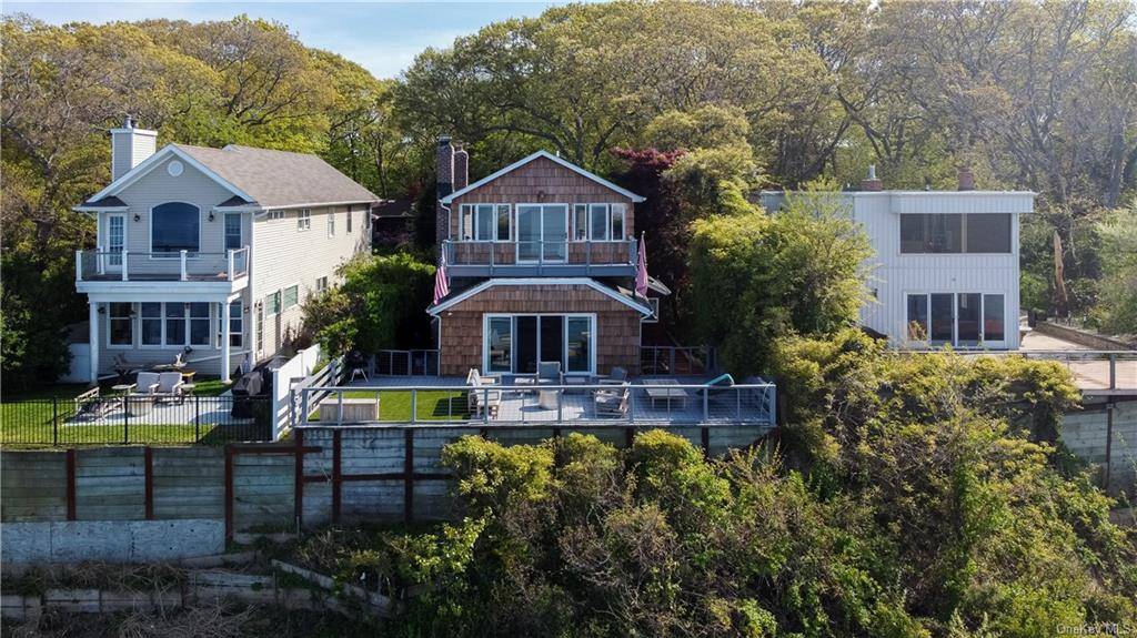 Custom waterfront home located in the most private beach community the North Shore has to offer.