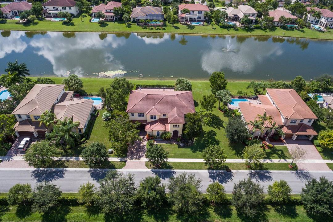 Stunning modern 6 bed 6bath lakefront pool home LOADED with recent upgrades, lush landscaping, soaring volume ceilings, spacious living areas, and tons of natural light.