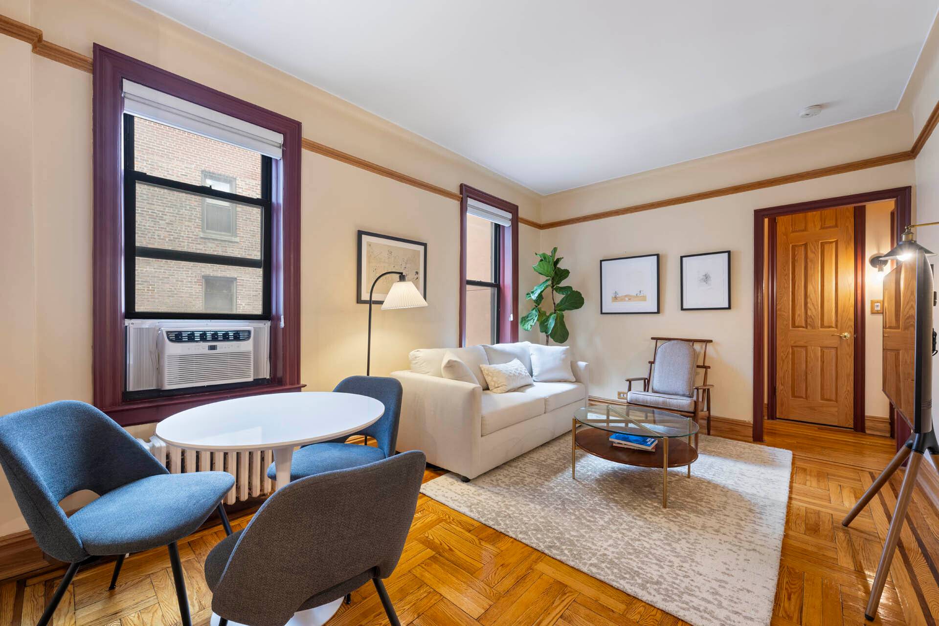 Pre war character and charm preserved with original wood detail and moldings professionally restored.
