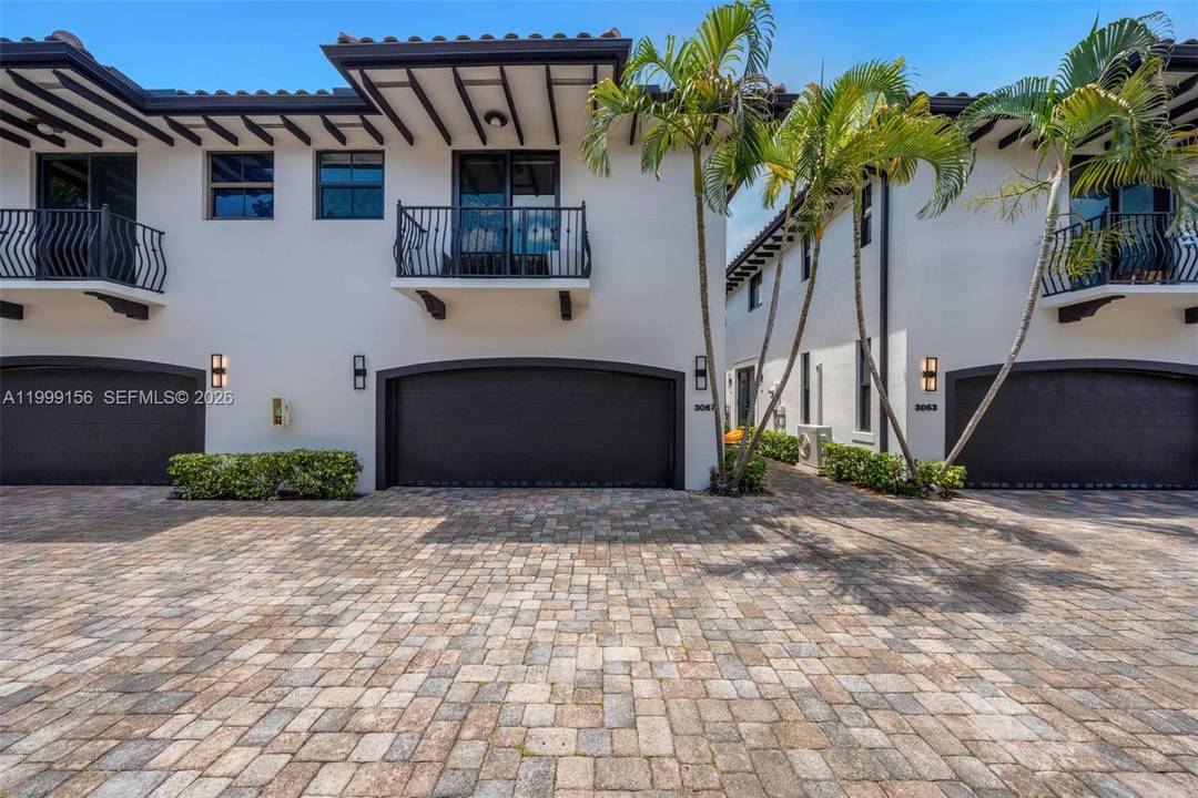 Beautiful open layout townhouse on a quiet, tree lined street in the heart of Coconut Grove.