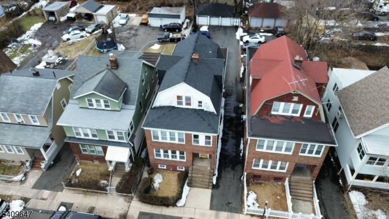 Welcome to this stunning three unit home nestled in one of East Orange's most convenient neighborhoods.