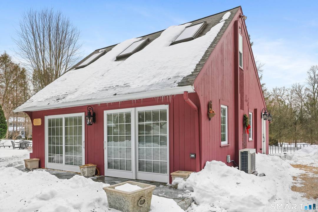 Charming two bedroom carriage house filled with natural light, set on two private acres.
