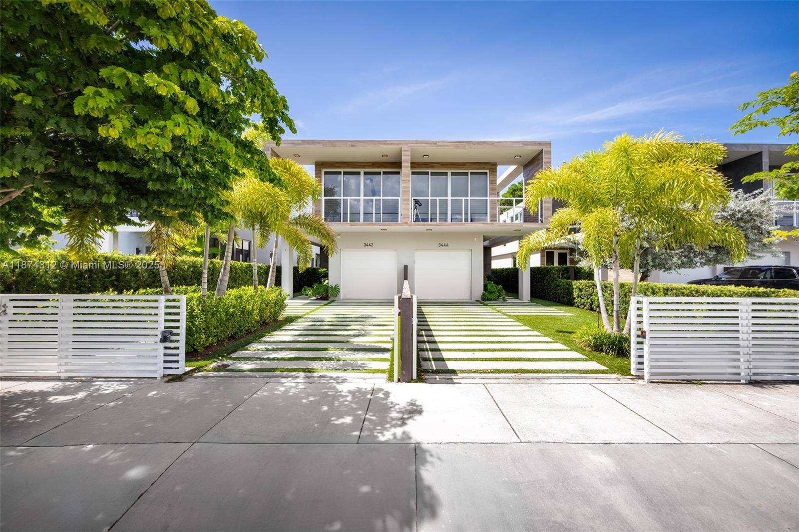 Modern elegance meets Grove charm in this 2020 townhome set in a prime walkable Coconut Grove location.
