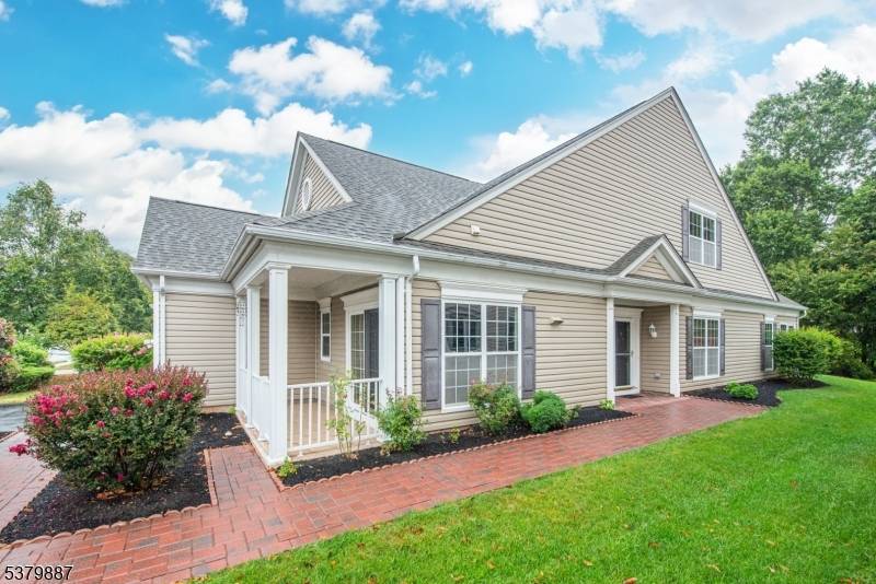 Nestled on a quiet, cul de sac street, this upgraded Astor Model w Sunroom Loft backs to woods !