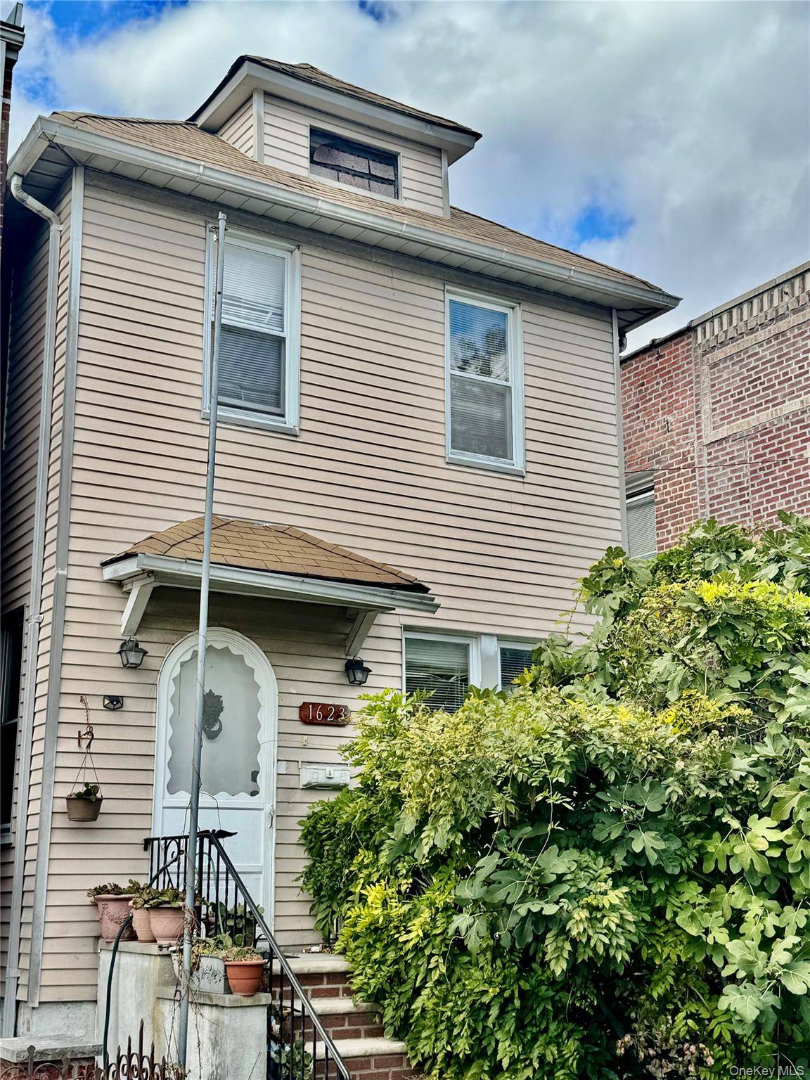 Nestled in the heart of Pelham Bay, 1623 Edison Avenue offers a rare opportunity to own a fully detached Legal 2 family home on a quiet, residential block.