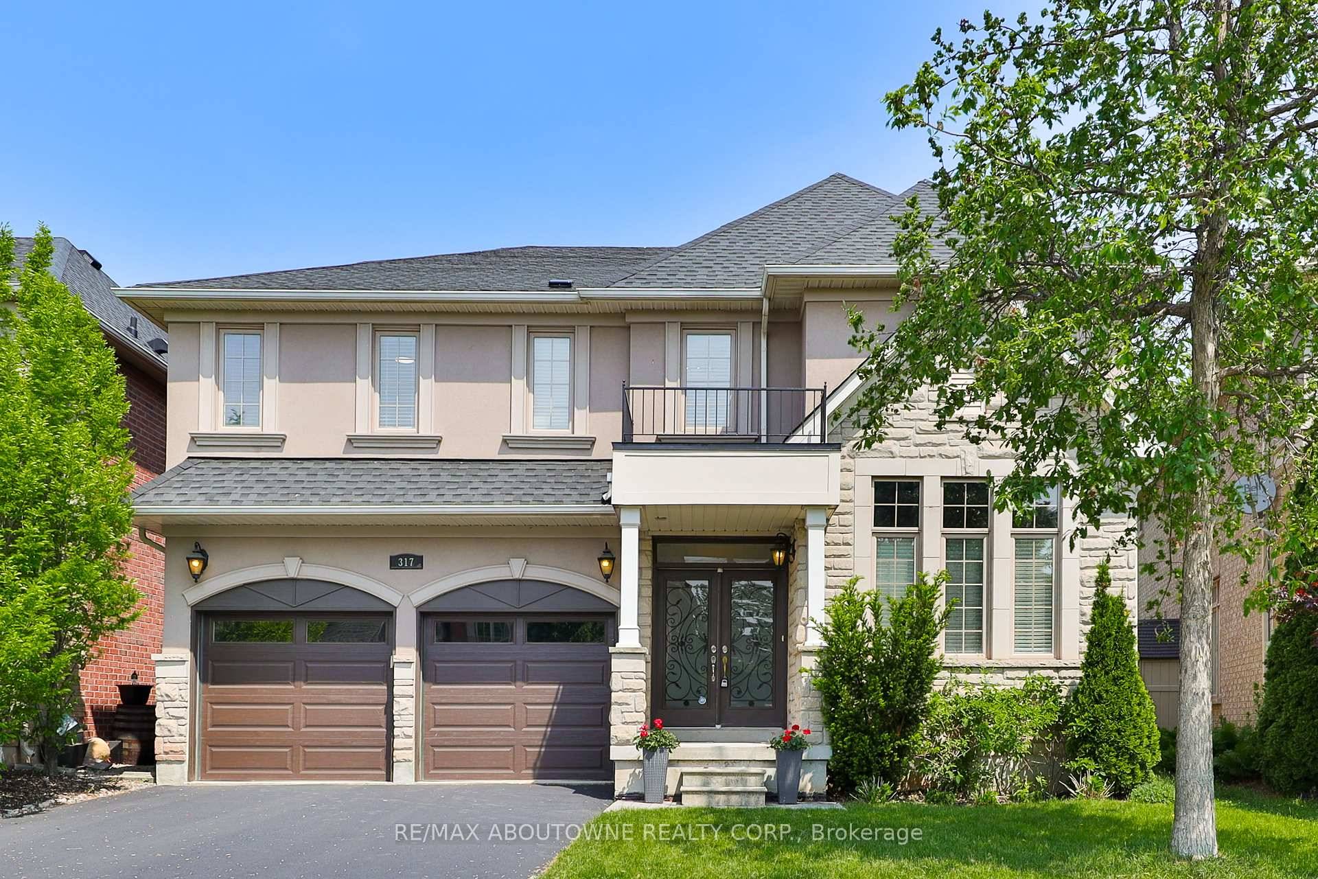 This beautiful family home is a rare Gem, located in the Prestigious Lakeshore Woods Community, backing onto lush treed green space.
