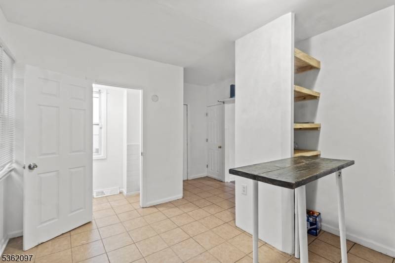 This charming single family home features two spacious bedrooms and one and a half baths, providing ample space for comfortable living.