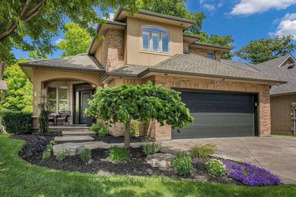 Meticulously maintained 4 bedroom, 4 bath family home situated on a premium ravine lot in Burlington's highly sought after Tansley Woods neighbourhood.