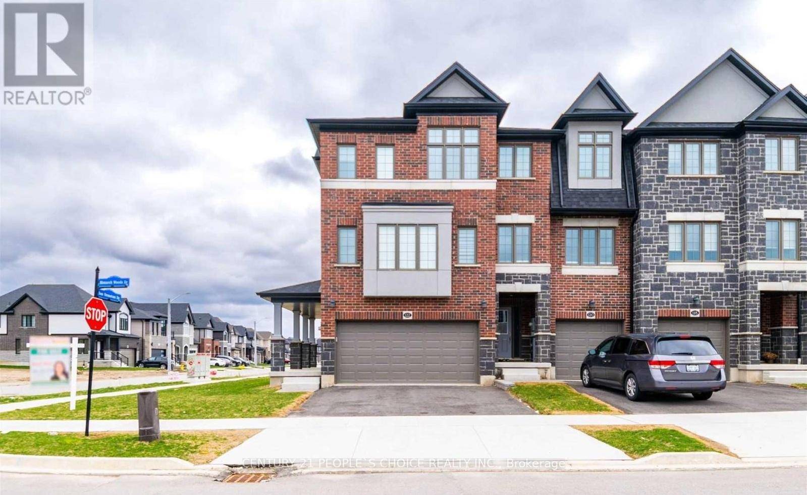 Welcome to Magnificent Monarch Woods, a stunning corner unit townhome in the highly sought after Doon South community, backing onto lush greenspace and filled with natural light.