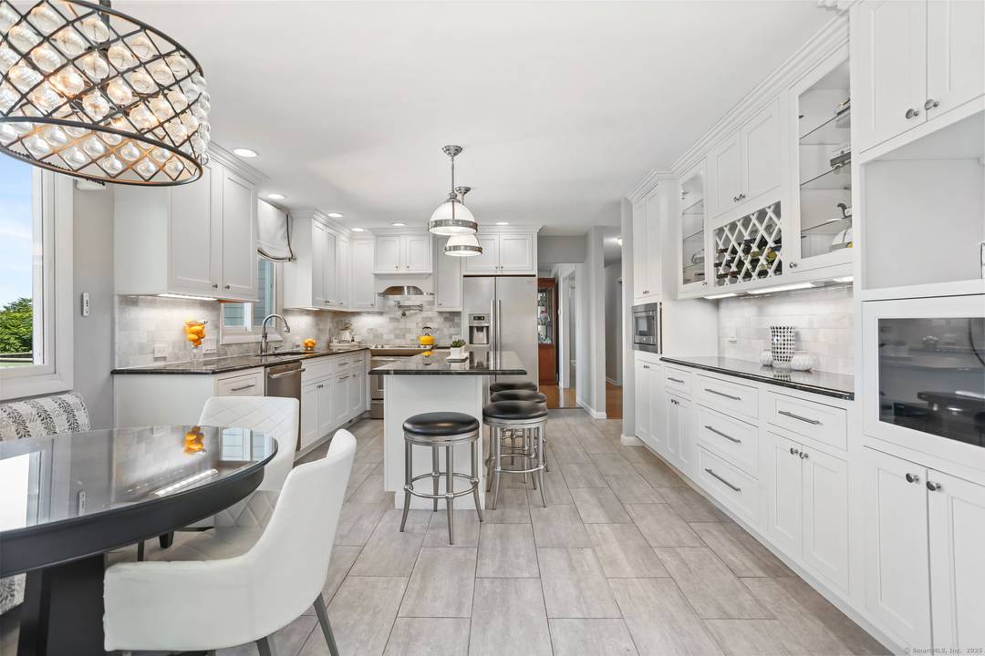 Welcome to this one of a kind property in Trumbull, offering over 7, 000 sf of living space across two separate ranch style units perfect for multi generational living, extended ...