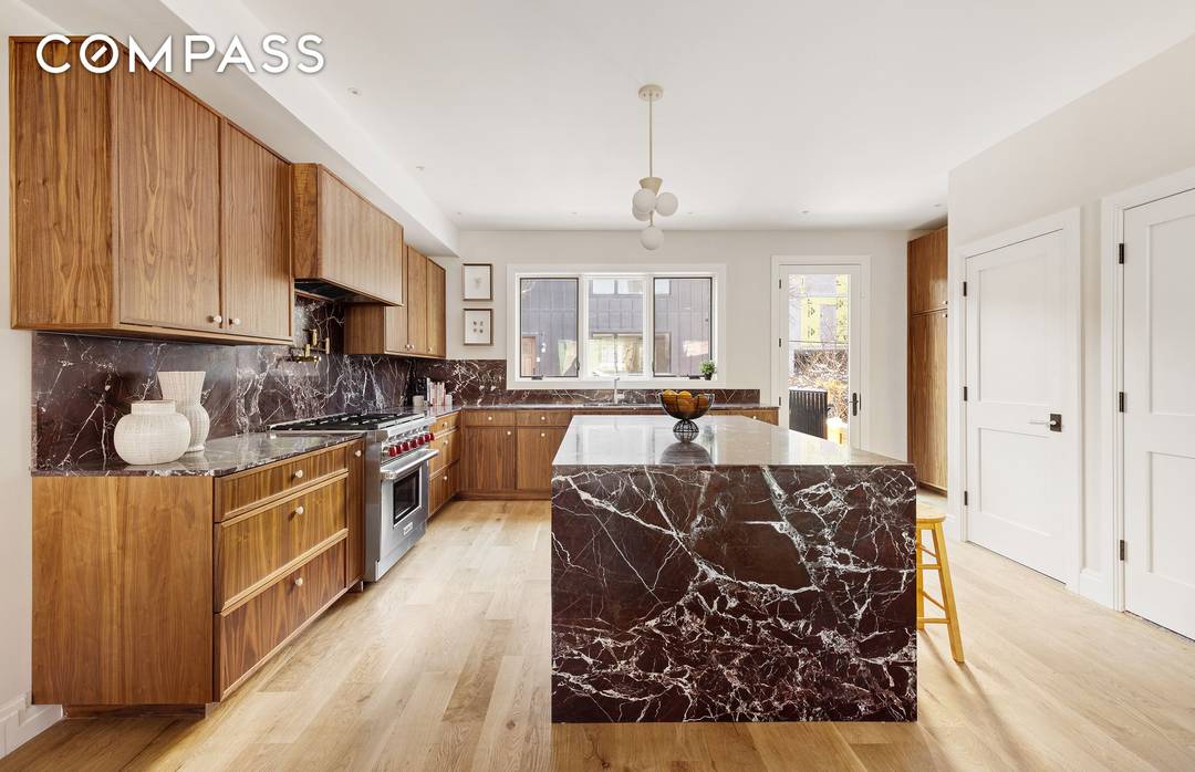 A rare Red Hook townhouse offering two separate residences on one oversized lot, delivering scale, flexibility, and long term value.