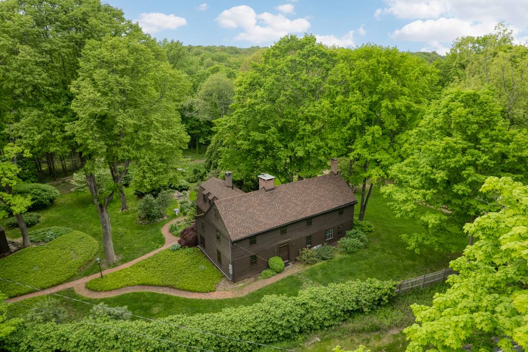 There is room to spare in this wonderful 10 room historic saltbox home that sits on 3.