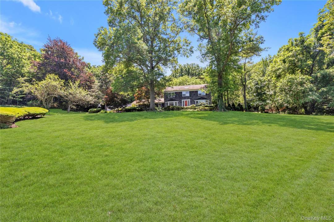 Prime location in the Village of Brookville featuring a very special opportunity to enjoy 5 car garage bays which includes a separate three car garage structure.