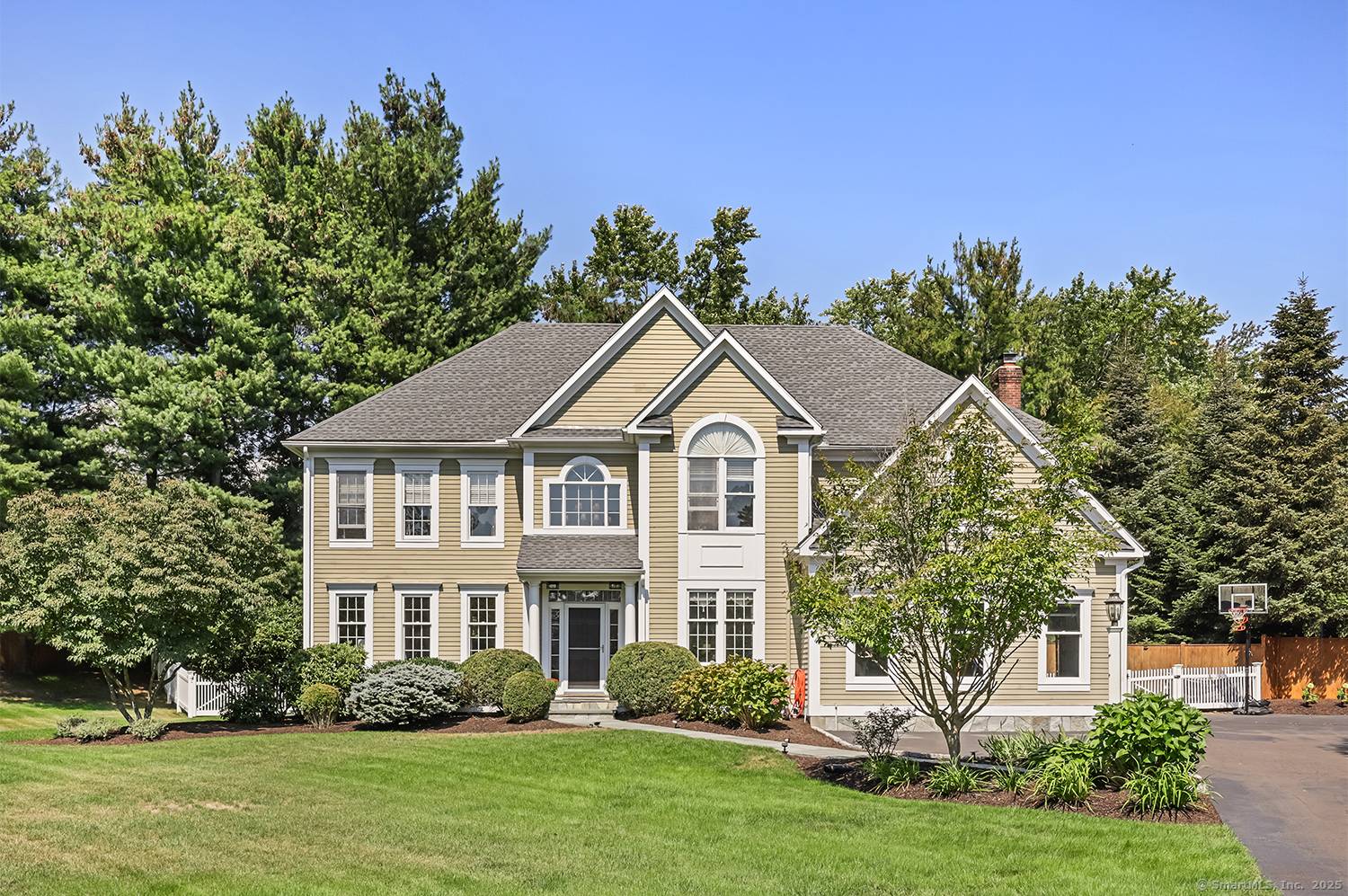 Tucked away on a serene street in the heart of Southport, this 4 bedroom, 4 bath Colonial invites you to experience the perfect balance of elegance, comfort, and privacy.