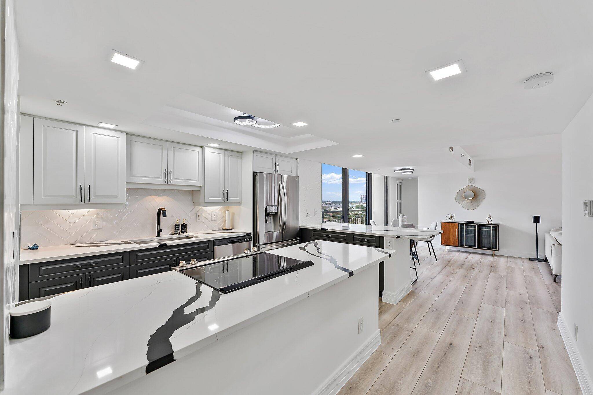 Welcome to 3000 N Ocean Drive Unit 14 A, where modern elegance meets coastal living.