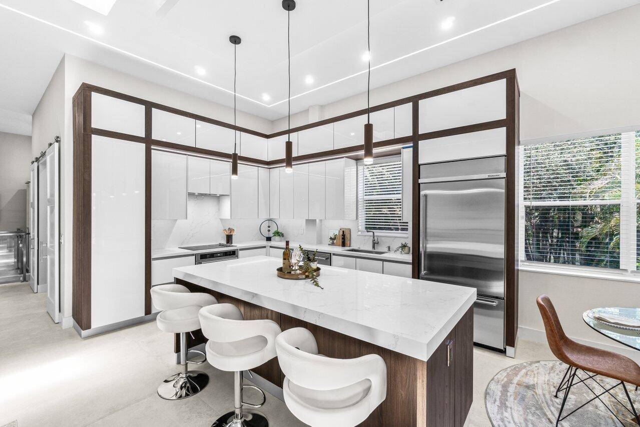 Welcome to a home that blends everyday comfort with sleek, contemporary design, an inviting second floor condo with a private elevator that's move in ready and beautifully updated throughout.