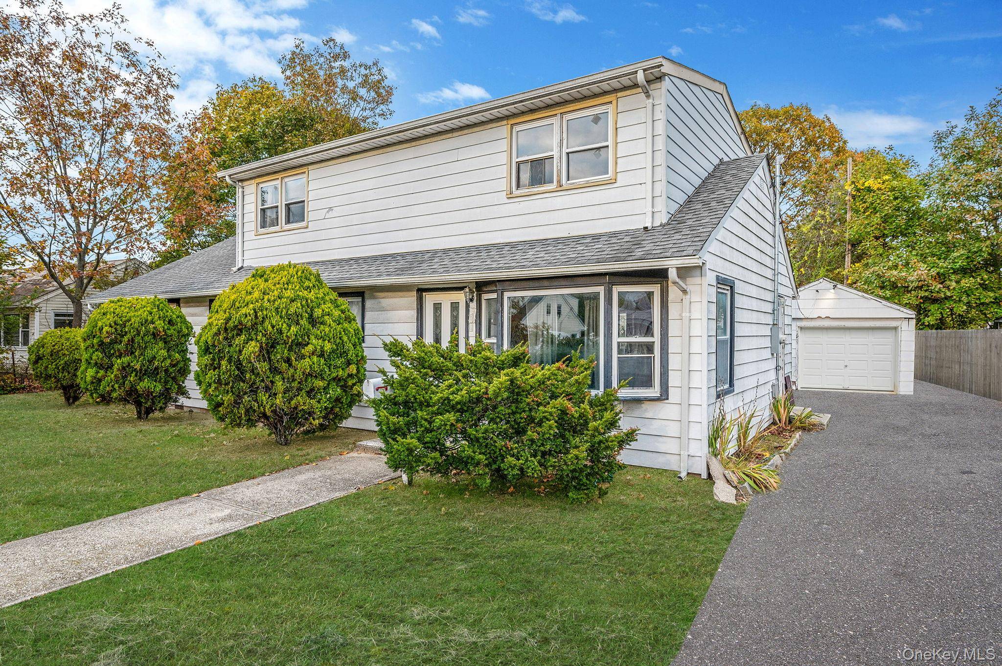 Endless possibilities await in this 5 bedroom, 2 bath home in Amityville.