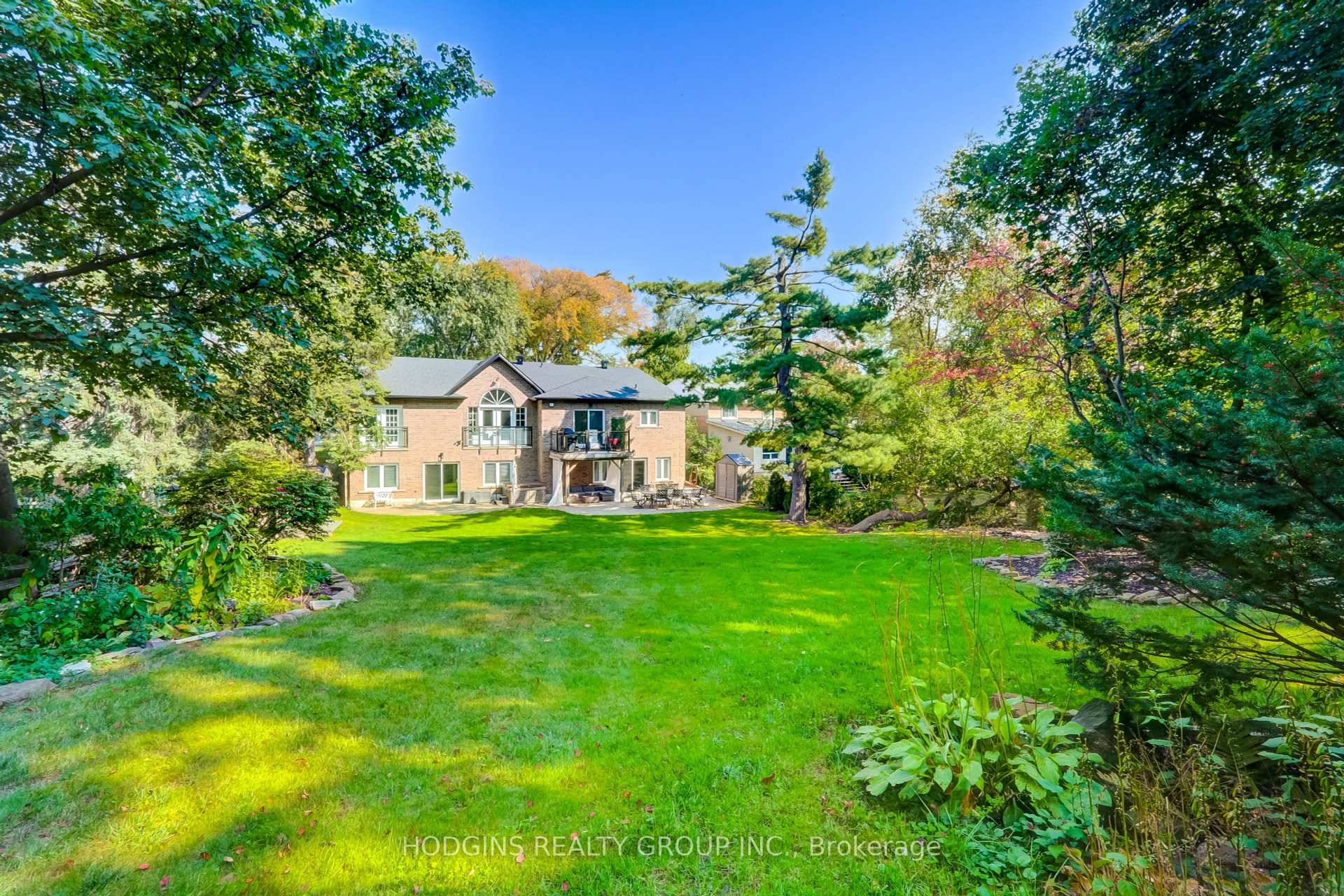 Simply extraordinary luxury modern bungalow with sensational showpiece double walk out lower level overlooking breathtaking private almost half acre estate lot.