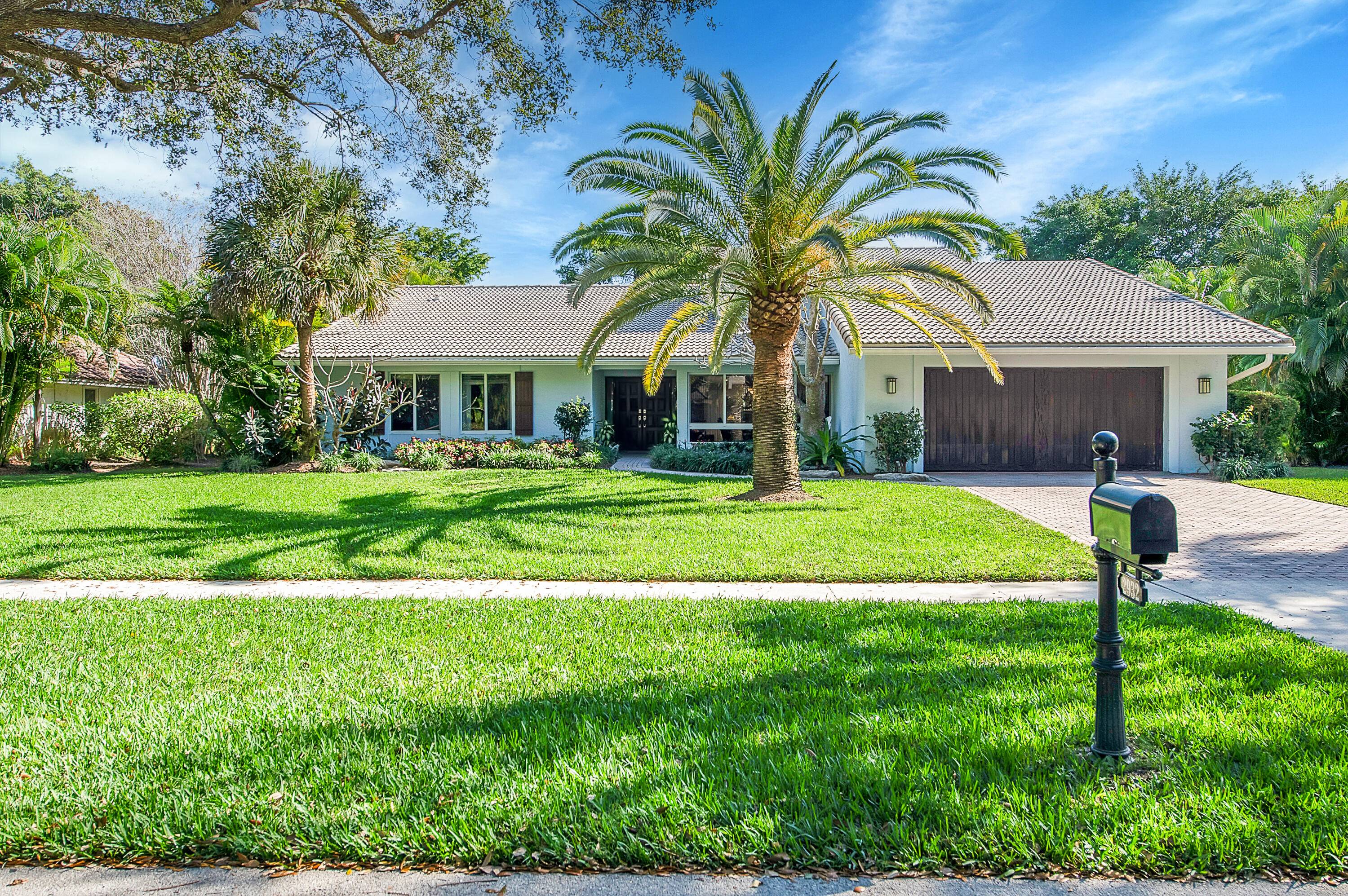 Stunning 4 BR 3 BA updated home in one of Boca's premier 24 hr guard gated communities.