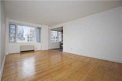 Spacious two bedroom apartment featuring a bright, open layout with a windowed kitchen and a generously sized living room.